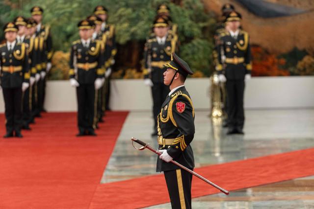 An honour guard stands during a welcome ceremony with Chinese President Xi Jinping and Uruguay's President Yamandu Orsi at the Great Hall of the People in Beijing on February 3, 2026. (Photo by JESSICA LEE / POOL / AFP)