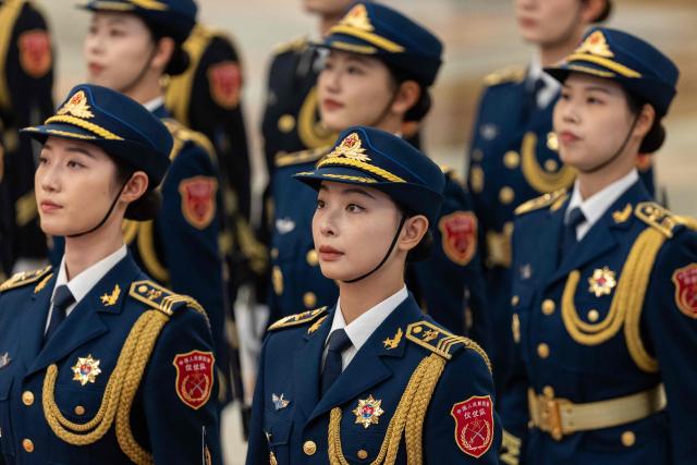 Guards stand in formation during a welcome ceremony with Chinese President Xi Jinping and Uruguay's President Yamandu Orsi at the Great Hall of the People in Beijing on February 3, 2026. (Photo by JESSICA LEE / POOL / AFP)