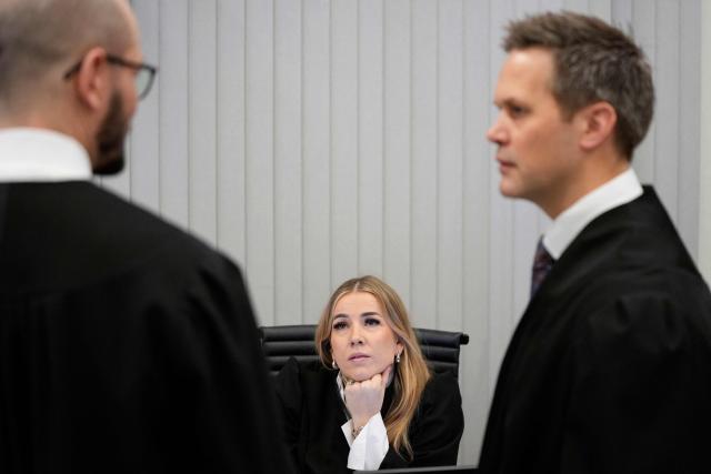 State Attorney and Prosecutor Sturla Henriksboe (R) and police prosecutor Andreas Kruszewski speak with assistant prosecutor Heidi Reinsvang (C) at the District Court in Oslo on February 3, 2026, prior to the start of the trial against Marius Borg Hoiby, son of Norway's Crown Princess Mette-Marit. In the biggest scandal to rock Norway's monarchy, the son of Crown Princess Mette-Marit goes on trial on February 3, accused of raping four women, as well as drug and assault offences. Marius Borg Hoiby, Mette-Marit's 29-year-old son from a relationship before she married Crown Prince Haakon, has been charged with a total of 38 counts, some of which date back to 2018. He faces up to 16 years in prison if the Oslo district court finds him guilty. The trial, scheduled to last until March 19, is expected to attract intense media coverage. (Photo by Ole Berg-Rusten / NTB / AFP) / Norway OUT