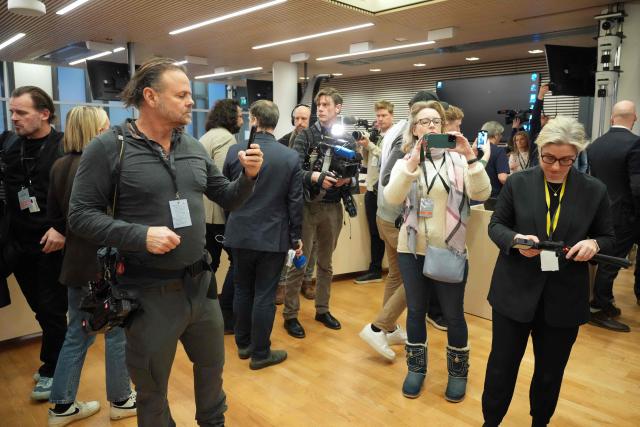 Journalists gather inside the District Court in Oslo on February 3, 2026, prior to the start of the trial against Marius Borg Hoiby, son of Norway's Crown Princess Mette-Marit. The son of Norway's crown princess pleaded not guilty on February 3 to four counts of rape at the opening of his high-profile trial in Oslo, an AFP journalist in the courtroom reported. Marius Borg Hoiby, Crown Princess Mette-Marit's 29-year-old son from a relationship prior to her marriage to Crown Prince Haakon, muttered a negative response when asked to enter his plea regarding the four rape charges. Hoiby, who is facing 38 charges on various offences and risks a total of 16 years in prison if convicted, pleaded guilty to some of the more minor offences. (Photo by Ole Berg-Rusten / NTB / AFP) / Norway OUT