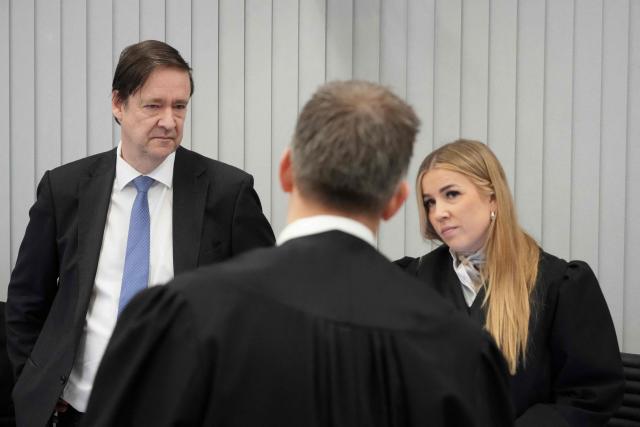 Defence attorney John Christian Elden and assistant prosecutor Heidi Reinsvang are pictured at the District Court in Oslo on February 3, 2026, prior to the start of the trial against Marius Borg Hoiby, son of Norway's Crown Princess Mette-Marit. In the biggest scandal to rock Norway's monarchy, the son of Crown Princess Mette-Marit goes on trial on February 3, accused of raping four women, as well as drug and assault offences. Marius Borg Hoiby, Mette-Marit's 29-year-old son from a relationship before she married Crown Prince Haakon, has been charged with a total of 38 counts, some of which date back to 2018. He faces up to 16 years in prison if the Oslo district court finds him guilty. The trial, scheduled to last until March 19, is expected to attract intense media coverage. (Photo by Ole Berg-Rusten / NTB / AFP) / Norway OUT