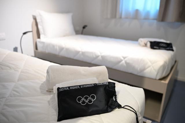 A standard double room for athletes is seen in the Team Italy quarters of the Olympic Village ahead of the Milano Cortina 2026 Winter Olympics in Milan on February 3, 2026. (Photo by PIERO CRUCIATTI / AFP)