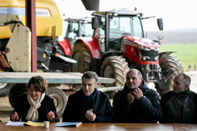 France's President Emmanuel Macron (2nd L) chairs a meeting with France's Minister for Agriculture and Food Sovereignty Annie Genevard (L) and representatives of local farmers unions during a visit at the Py brothers farm in Vallerois-le-Bois, eastern France, on February 3, 2026. (Photo by SEBASTIEN BOZON / POOL / AFP)