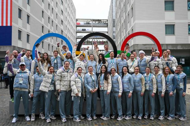 Team France's women Ice Hockey team poses with the Olympic rings at the Olympic Village ahead of the Milano Cortina 2026 Winter Olympics in Milan on February 3, 2026. (Photo by PIERO CRUCIATTI / AFP)