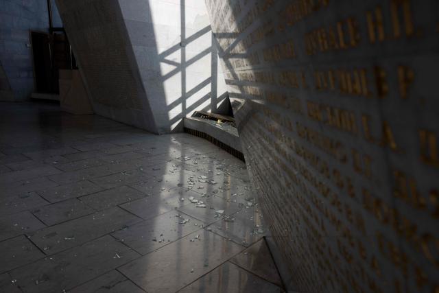 This photograph shows broken glass by damaged windows following a Russian strike in The National Museum of the History of Ukraine in the Second World War in Kyiv on February 3, 2026, amid the Russian invasion of Ukraine. (Photo by Tetiana DZHAFAROVA / AFP)