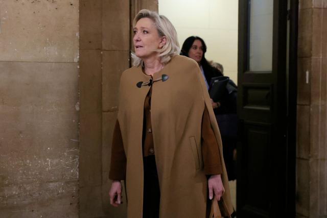 President of the parliamentary group of the French far-right Rassemblement National (RN) party, Marine Le Pen arrives after a break during her appeal trial on charges of embezzlement of European public funds in a case of alleged European Parliament fake jobs at the Palais de Justice in Paris on February 3, 2026. Le Pen is called to the stand in the appeal trial in Paris of the parliamentary assistants of the National Front, where she is playing for her candidacy for the 2027 presidential election. Twelve of the accused, as well as the far-right party itself, have appealed against the verdict while another 12 people -- including one of Le Pen's sisters -- have decided to accept their convictions without appealing. The public prosecutor's office is expected to announce its charges against Marine Le Pen, the National Rally party, and ten party officials on February 3, 2026. (Photo by Thomas SAMSON / AFP)