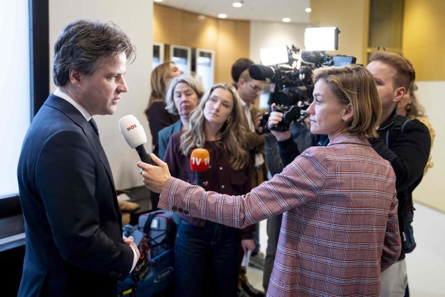 Leader of the Christian Democratic Appeal (CDA) party Henri Bontenbal (L) speaks to journalists before a debate in the House of Representatives on the coalition agreement between D66, VVD, and CDA and the final report by informant Rianne Letschert in The Hague on February 3, 2026. (Photo by Jeroen Jumelet / ANP / AFP) / Netherlands OUT