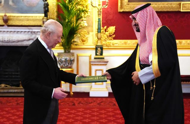 Britain's King Charles III (L) receives Prince Abdullah Bin Khaled Al Saud, Saudi Arabi's Ambassador to the United Kingdom, as he presents his credentials at St James's Palace in London on February 3, 2026. (Photo by Jonathan Brady / POOL / AFP)