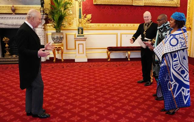 Britain's King Charles III (L) receives Mosuoe Letuma, Lesotho's High Commissioner to the United Kingdom, and his wife Makabelo Temana Junior Letuma, as he presents his credentials at St James's Palace in London on February 3, 2026. (Photo by Jonathan Brady / POOL / AFP)