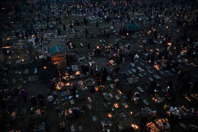 Kashmiri Shiite Muslims offer prayers and light candles over their relatives' graves to mark Shab-e-Barat, or the night of forgiveness, at a graveyard in Srinagar on February 3, 2026. (Photo by Tauseef MUSTAFA / AFP)