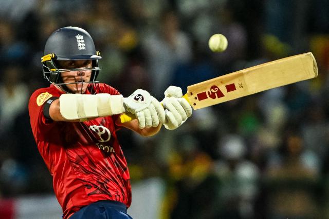 England's Sam Curran plays a shot during the third and final Twenty20 international cricket match between Sri Lanka and England at the Pallekele International Cricket Stadium in Kandy on February 3, 2026. (Photo by Ishara S. KODIKARA / AFP)