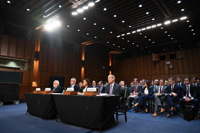 (L/R) Rabbi Abraham Cooper, Robert Karofsky, Global Wealth Management President at UBS Americas, Barbara Levi, General Counsel at UBS Group AG, and Neil Barofsky, partner at Jenner and Block LLP, testify during a Senate Judiciary Committee hearing titled "The Truth Revealed: Hidden Facts Regarding Nazis and Swiss Banks," on Capitol Hill in Washington, DC, on February 3, 2026. (Photo by ROBERTO SCHMIDT / AFP)