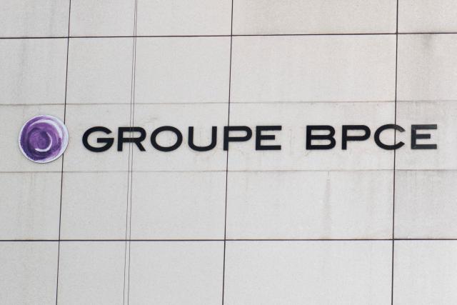 (FILES) This photograph shows the logo of the BPCE group, a French banking group, on a building facade in Charenton-le-Pont, on June 17, 2025. France's BPCE banking group reports a record net profit of 4.1 billion euros in 2025, a 15% increase driven by organic growth across all its businesses, particularly its retail banking and insurance division, the group says on February 3, 2026. (Photo by Martin LELIEVRE / AFP)