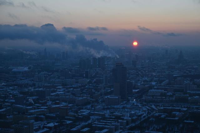 A general view of the Russian capital of Moscow taken from the 337m high observation deck of the 540-metre (1,780-foot) Ostankino TV tower at sunset in Moscow during a frosty day on February 3, 2026. (Photo by Hector RETAMAL / AFP)
