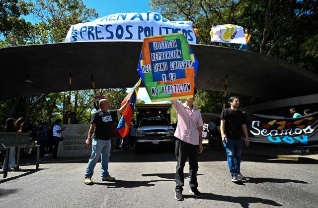 College students, unions and families of political prisoners call for full amnesty during a demonstration in Caracas on February 3, 2026. Venezuela's acting president Delci Rodriguez announced on January 30 a proposal for mass amnesty in the country, in her latest major reform since the US toppling of Nicolas Maduro just weeks ago. (Photo by Juan BARRETO / AFP)