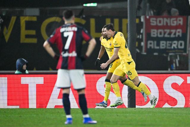 AC Milan's French forward #18 Christopher Nkunku (2R) celebrates after scoring a penalty during the Italian Serie A football match between Bologna and AC Milan at the Renato Dall'Ara stadium in Bologna on February 3, 2026. (Photo by Andreas SOLARO / AFP)