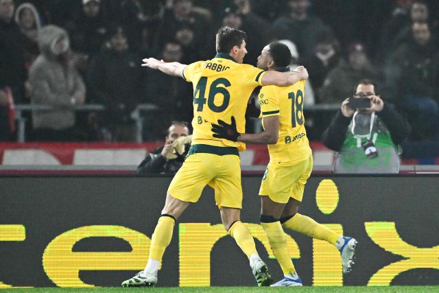 AC Milan's French forward #18 Christopher Nkunku (R) celebrates after scoring a penalty during the Italian Serie A football match between Bologna and AC Milan at the Renato Dall'Ara stadium in Bologna on February 3, 2026. (Photo by Andreas SOLARO / AFP)