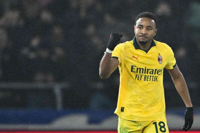 AC Milan's French forward #18 Christopher Nkunku celebrates after scoring a goal from the penalty spot during the Italian Serie A football match between Bologna and AC Milan at the Renato Dall'Ara stadium in Bologna on February 3, 2026. (Photo by Andreas SOLARO / AFP)