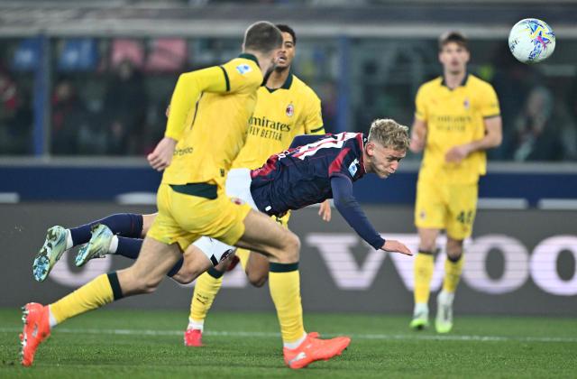 Bologna's Danish forward #21 Jens Odgaard (C) heads the ball towards goal during the Italian Serie A football match between Bologna and AC Milan at the Renato Dall'Ara stadium in Bologna on February 3, 2026. (Photo by Andreas SOLARO / AFP)