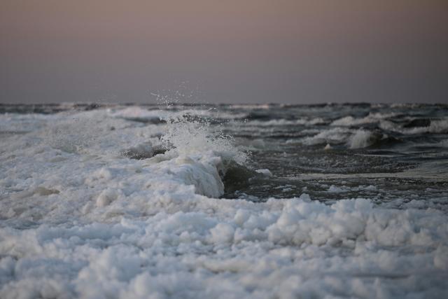 TOPSHOT - Waves of the Baltic Sea meet the ice near Mikoszewo, northern Poland on February 3, 2026. (Photo by Sergei GAPON / AFP)