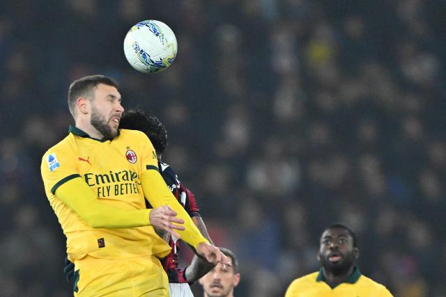 AC Milan's Serbian defender #31 Strahinja Pavlovic (L) heads the ball during the Italian Serie A football match between Bologna and AC Milan at the Renato Dall'Ara stadium in Bologna on February 3, 2026. (Photo by Andreas SOLARO / AFP)