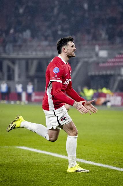 AZ Alkmaar's Irish forward #09 Troy Parrott celebrates after scoring his team's second goal during the KNVB Cup quarterfinal football match between AZ Alkmaar and FC Twente at the AFAS Stadium in Alkmaar on February 3, 2026. (Photo by Tobias Kleuver / ANP / AFP) / Netherlands OUT