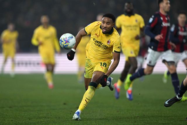 AC Milan's French forward #18 Christopher Nkunku (C) chases the ball during the Italian Serie A football match between Bologna and AC Milan at the Renato Dall'Ara stadium in Bologna on February 3, 2026. (Photo by Andreas SOLARO / AFP)