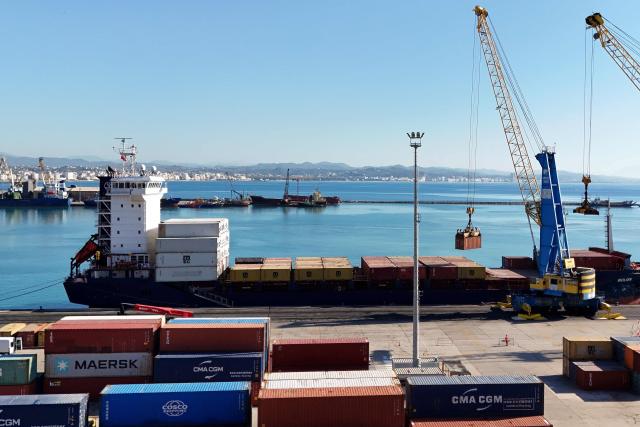 (FILES) This photograph shows the Turkish-flagged Moliva container ship, carrying hundreds of tonnes of possibly toxic industrial waste, at the port of Durres, on November 8, 2024. The Durres Prosecutor's Office issued 33 arrest warrants on February 3, 2026 for suspected involvement in the trafficking of toxic waste that was turned away by Thailand. The waste left the Balkan nation in July 2024 in more than 100 containers. Thailand rejected the consignment following claims by an environmental group that it was illegal toxic waste. The shipment then returned to Albania. (Photo by Adnan Beci / AFP)