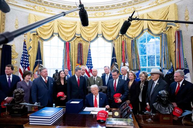 US President Donald Trump, surrounded by members of Congress, speaks with the media after signing a funding bill to end a partial government shutdown in the Oval Office of the White House in Washington, DC, February 3, 2026. The US House of Representatives passed a spending bill on Tuesday ending the four-day partial government shutdown sparked by Democratic opposition to funding for the federal agency carrying out President Donald Trump's immigration crackdown. (Photo by SAUL LOEB / AFP)