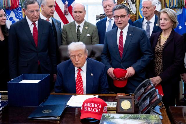US Speaker of the House Mike Johnson (2nd R) speaks alongside US President Donald Trump, surrounded by members of Congress, prior to Trump signing a funding bill to end a partial government shutdown in the Oval Office of the White House in Washington, DC, February 3, 2026. The US House of Representatives passed a spending bill on Tuesday ending the four-day partial government shutdown sparked by Democratic opposition to funding for the federal agency carrying out President Donald Trump's immigration crackdown. (Photo by SAUL LOEB / AFP)