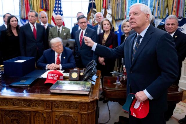 US Senator Lindsey Graham (R), Republican of South Carolina, speaks to the press alongside US President Donald Trump, surrounded by members of Congress, after Trump signed a funding bill to end a partial government shutdown in the Oval Office of the White House in Washington, DC, February 3, 2026. The US House of Representatives passed a spending bill on Tuesday ending the four-day partial government shutdown sparked by Democratic opposition to funding for the federal agency carrying out President Donald Trump's immigration crackdown. (Photo by SAUL LOEB / AFP)