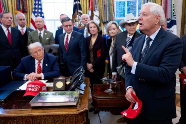 US Senator Lindsey Graham (R), Republican of South Carolina, speaks to the press alongside US President Donald Trump, surrounded by members of Congress, after Trump signed a funding bill to end a partial government shutdown in the Oval Office of the White House in Washington, DC, February 3, 2026. The US House of Representatives passed a spending bill on Tuesday ending the four-day partial government shutdown sparked by Democratic opposition to funding for the federal agency carrying out President Donald Trump's immigration crackdown. (Photo by SAUL LOEB / AFP)