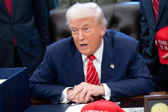 US President Donald Trump speaks with the media after signing a funding bill to end a partial government shutdown in the Oval Office of the White House in Washington, DC, February 3, 2026. The US House of Representatives passed a spending bill on Tuesday ending the four-day partial government shutdown sparked by Democratic opposition to funding for the federal agency carrying out President Donald Trump's immigration crackdown. (Photo by SAUL LOEB / AFP)