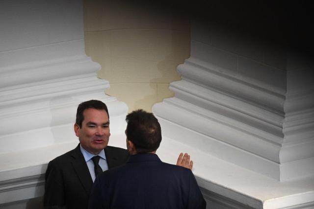 Opposition deputies Tomas Guanipa (L) and Stalin Gonzalez talk during a National Assembly session in Caracas on February 3, 2026. Thousands of backers of Venezuela's former leader Nicolas Maduro, who was ousted in a deadly US military operation, marched in Caracas on February 3 to demand his freedom. (Photo by Federico PARRA / AFP)