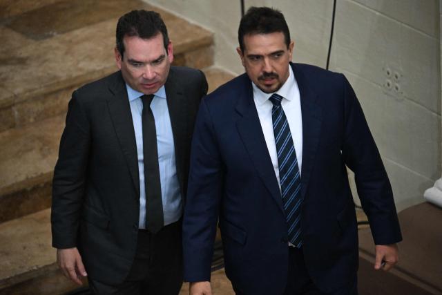 Opposition deputies Tomas Guanipa (L) and Stalin Gonzalez attend a National Assembly session in Caracas on February 3, 2026. Thousands of backers of Venezuela's former leader Nicolas Maduro, who was ousted in a deadly US military operation, marched in Caracas on February 3 to demand his freedom. (Photo by Federico PARRA / AFP)