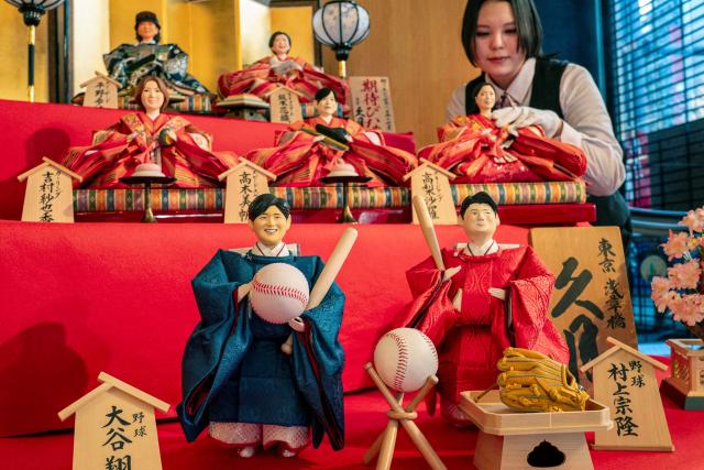 Hina dolls modeled after notable figures expected to make an impact this year including Japanese Major League baseball players, Los Angeles Dodgers' Shohei Ohtani (front L), Chicago White Sox's Munetaka Murakami (front R), as well as Olympic athletes, are displayed at the doll maker Kyugetsu in Tokyo on February 4, 2026, in anticipation of Hina Matsuri or Girls' Day on March 3, a festival celebrating health and happiness of young girls. (Photo by Kazuhiro NOGI / AFP)
