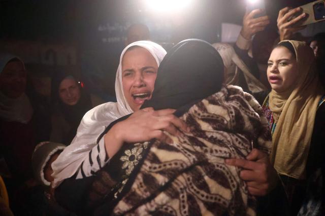 Palestinian women, coming from the Rafah crossing with Egypt, hug as they arrive at Nasser Hospital in Khan Yunis in the southern Gaza Strip on February 4, 2026. Gazans long-separated from their loved ones shed tears of joy after the limited reopening of the Rafah crossing with Egypt allowed a handful to finally return to the war-shattered territory. Jubilant crowds filmed on their phones as they flocked around a bus carrying returnees to Nasser Hospital in the southern city of Khan Yunis late in the night. (Photo by Bashar Taleb / AFP)