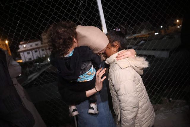 A Palestinian family, coming from the Rafah crossing with Egypt, arrives at Nasser Hospital in Khan Yunis in the southern Gaza Strip on February 4, 2026. Gazans long-separated from their loved ones shed tears of joy after the limited reopening of the Rafah crossing with Egypt allowed a handful to finally return to the war-shattered territory. Jubilant crowds filmed on their phones as they flocked around a bus carrying returnees to Nasser Hospital in the southern city of Khan Yunis late in the night. (Photo by Bashar Taleb / AFP)