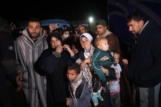 Palestinians coming from the Rafah crossing from Egypt arrive at Nasser Hospital in Khan Yunis in the southern Gaza Strip on February 4, 2026. Gazans long-separated from their loved ones shed tears of joy after the limited reopening of the Rafah crossing with Egypt allowed a handful to finally return to the war-shattered territory. Jubilant crowds filmed on their phones as they flocked around a bus carrying returnees to Nasser Hospital in the southern city of Khan Yunis late in the night. (Photo by Bashar Taleb / AFP)