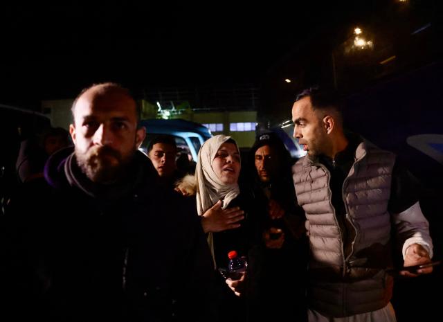 Palestinians coming from the Rafah crossing from Egypt arrive at Nasser Hospital in Khan Yunis in the southern Gaza Strip on February 4, 2026. Gazans long-separated from their loved ones shed tears of joy after the limited reopening of the Rafah crossing with Egypt allowed a handful to finally return to the war-shattered territory. Jubilant crowds filmed on their phones as they flocked around a bus carrying returnees to Nasser Hospital in the southern city of Khan Yunis late in the night. (Photo by Bashar Taleb / AFP)