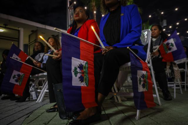 People attend a candlelight vigil for Haitians living in the US under the Temporary Protected Status (TPS) immigration program in Miami, Florida on February 3, 2026. Late on February 2, federal judge Ana C. Reyes of the Federal District Court in Washington, blocked the Trump administration from ending TPS for an estimated 350,000 Haitian immigrants. The status, which offers protection from deportation and work authorization, was set to expire on Feb. 3. (Photo by Giorgio Viera / AFP)