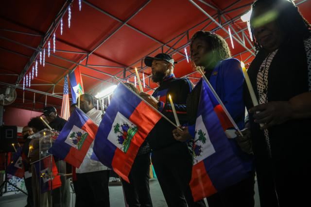 People attend a candlelight vigil for Haitians living in the US under the Temporary Protected Status (TPS) immigration program in Miami, Florida on February 3, 2026. Late on February 2, federal judge Ana C. Reyes of the Federal District Court in Washington, blocked the Trump administration from ending TPS for an estimated 350,000 Haitian immigrants. The status, which offers protection from deportation and work authorization, was set to expire on Feb. 3. (Photo by Giorgio Viera / AFP)