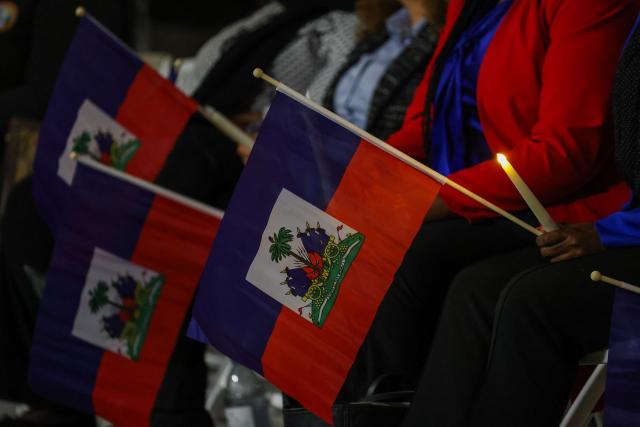 People attend a candlelight vigil for Haitians living in the US under the Temporary Protected Status (TPS) immigration program in Miami, Florida on February 3, 2026. Late on February 2, federal judge Ana C. Reyes of the Federal District Court in Washington, blocked the Trump administration from ending TPS for an estimated 350,000 Haitian immigrants. The status, which offers protection from deportation and work authorization, was set to expire on Feb. 3. (Photo by Giorgio Viera / AFP)