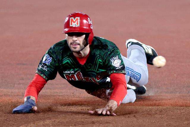 Charros de Jalisco's #26 Michael Wielansky dives to third base in the first inning of the Caribbean Series baseball tournament sixth game between Mexico's Charros de Jalisco and Puerto Rico's Cangrejeros de Santurce at the Panamerican Stadium in Jalisco, Mexico, on February 3, 2026. (Photo by Ulises Ruiz / AFP)