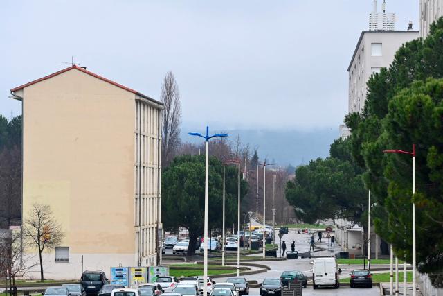 This photograph shows the Cevennes district in Ales, southern France on January 22, 2026, during a visit of drug dealing spots by French prosecutors. "The street sweeper can no longer come to clean, and at night there is gunfire": for this Alès resident, the arrival of the Marseille-based DZ Mafia criminal group in this small Gard town, as elsewhere in France, makes life increasingly unbearable.

"If the mayor wants us to vote for him in the neighborhood, he has to eradicate this problem", said this woman who requested anonymity just a few weeks before the municipal elections at the foot of her building where tags display the price per gram of cannabis or cocaine. (Photo by Sylvain THOMAS / AFP)