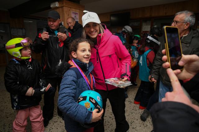 (FILES) French skier Perrine Laffont (C), five-time world champion in mogul skiing, poses for a picture at the Monts d'Olmes, her home station, in Montferrier, southwestern France, on March 11, 2023. In the heart of Ariege, in the Monts d'Olmes resort where Olympic champion Perrine Laffont grew up, heavy snowfall like this winter is increasingly rare because of climate change, which is forcing a new way of "approaching the mountains". (Photo by Valentine CHAPUIS / AFP)