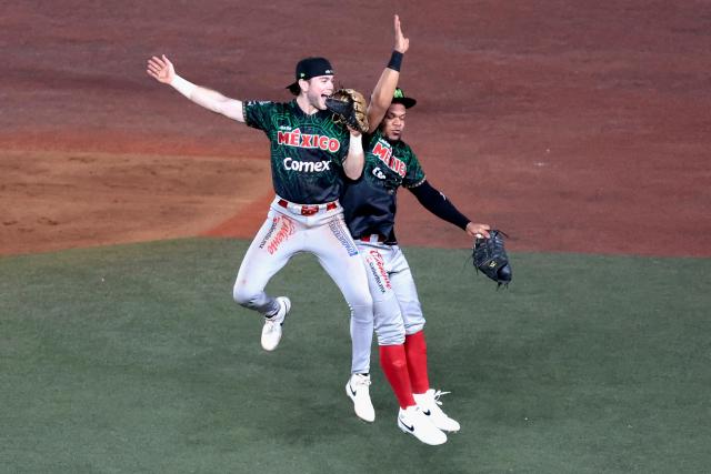 Players of Charros de Jalisco celebrate at the end of the ninth inning of the Caribbean Series baseball tournament sixth game between Mexico's Charros de Jalisco and Puerto Rico's Cangrejeros de Santurce at the Panamerican Stadium in Jalisco, Mexico, on February 3, 2026. (Photo by Ulises Ruiz / AFP)