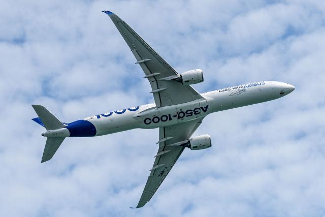 An Airbus' A350-1000 airliner takes part in an aerial display at the Singapore Airshow in Singapore on February 4, 2026. (Photo by Roslan RAHMAN / AFP)