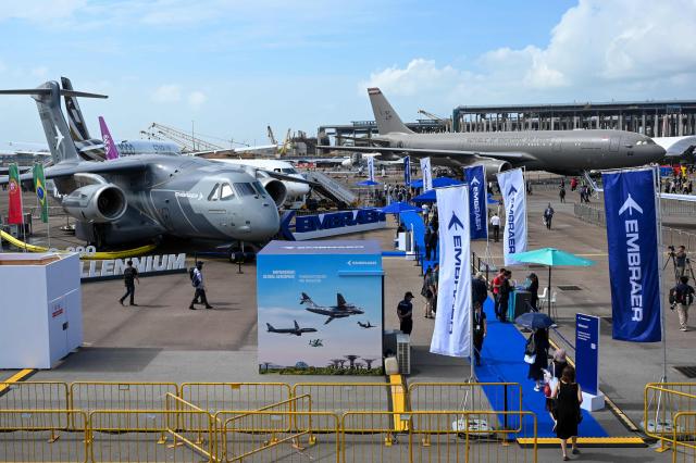 Embraer aircraft are displayed at the Singapore Airshow in Singapore on February 4, 2026. (Photo by Roslan RAHMAN / AFP)