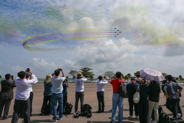 Aircraft of the Chinese People’s Liberation Army Air Force's Bayi aerobatic team perform an aerial display at the Singapore Airshow in Singapore on February 4, 2026. (Photo by Roslan RAHMAN / AFP)